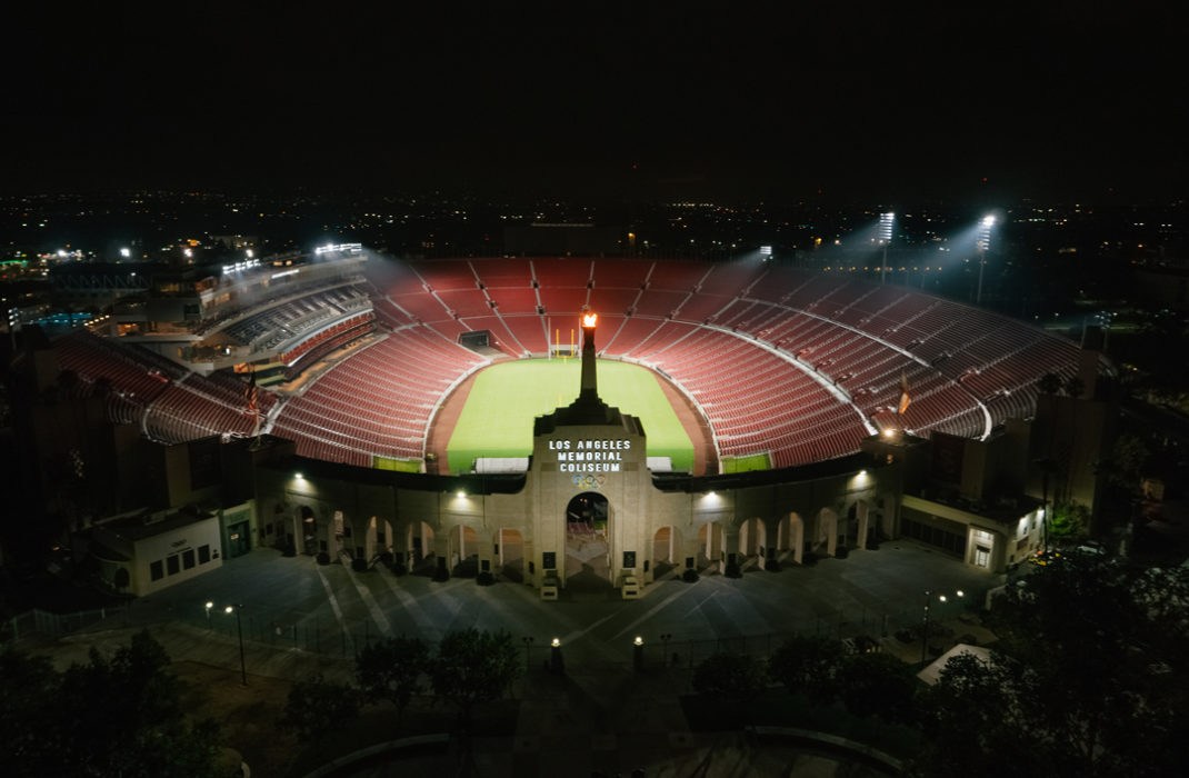 field with bleachers at night