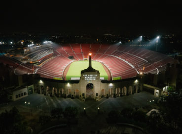 field with bleachers at night