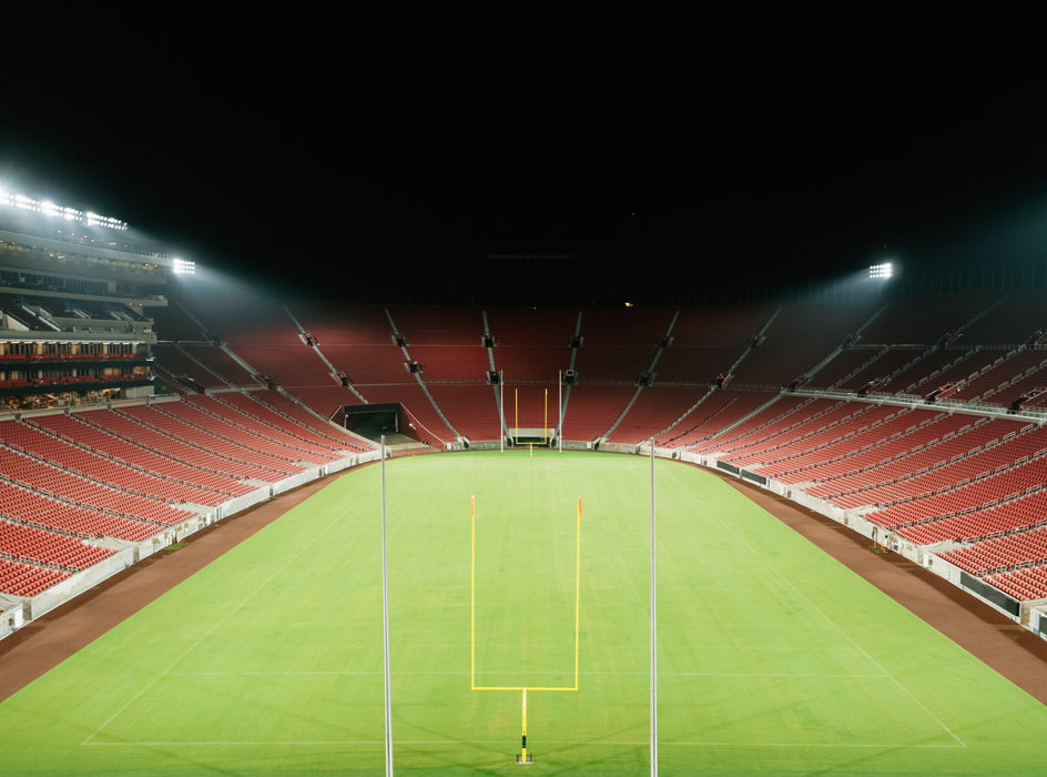 field with bleachers at night