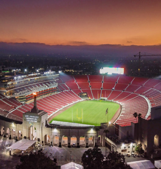 full stadium view with sunset in sky