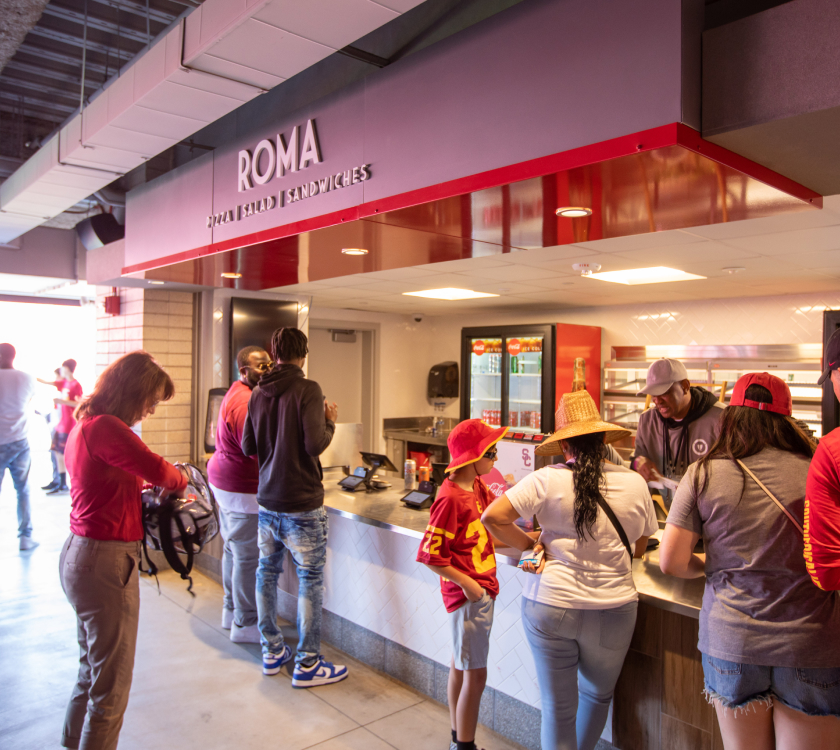 people waiting in line for food