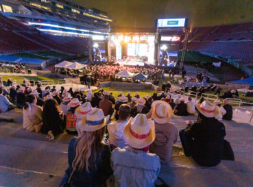 people sitting with hats